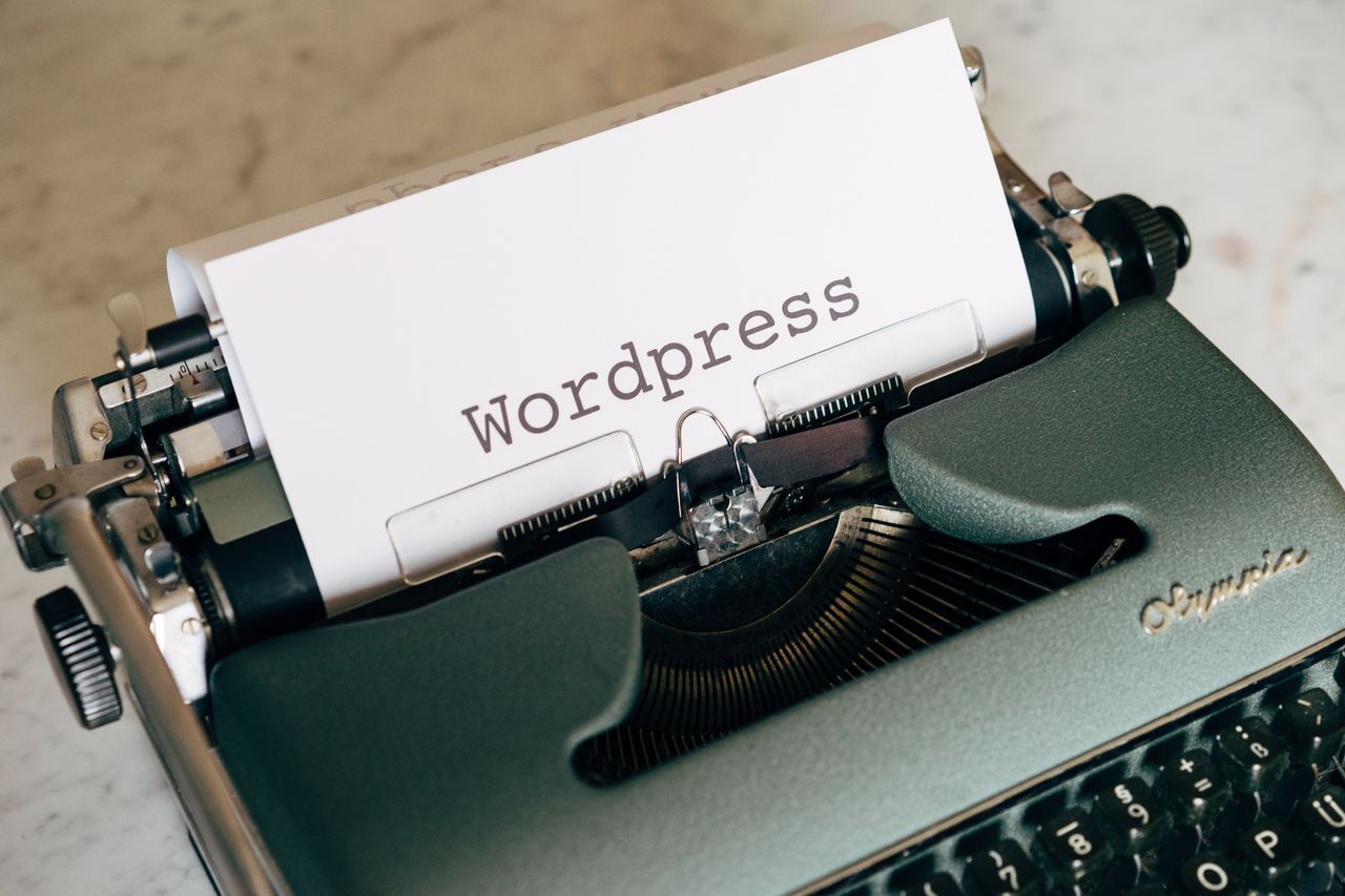 Services Close-up of a vintage typewriter with paper labeled WordPress.