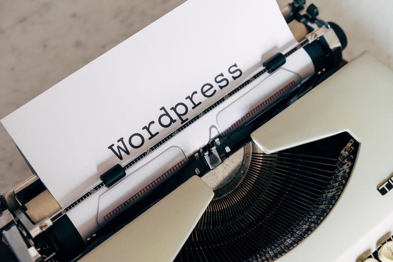 Mastering the First Impression: Your intriguing post title goes here Close-up of a vintage typewriter with a paper displaying 'WordPress', ideal for blogging and writing concepts.